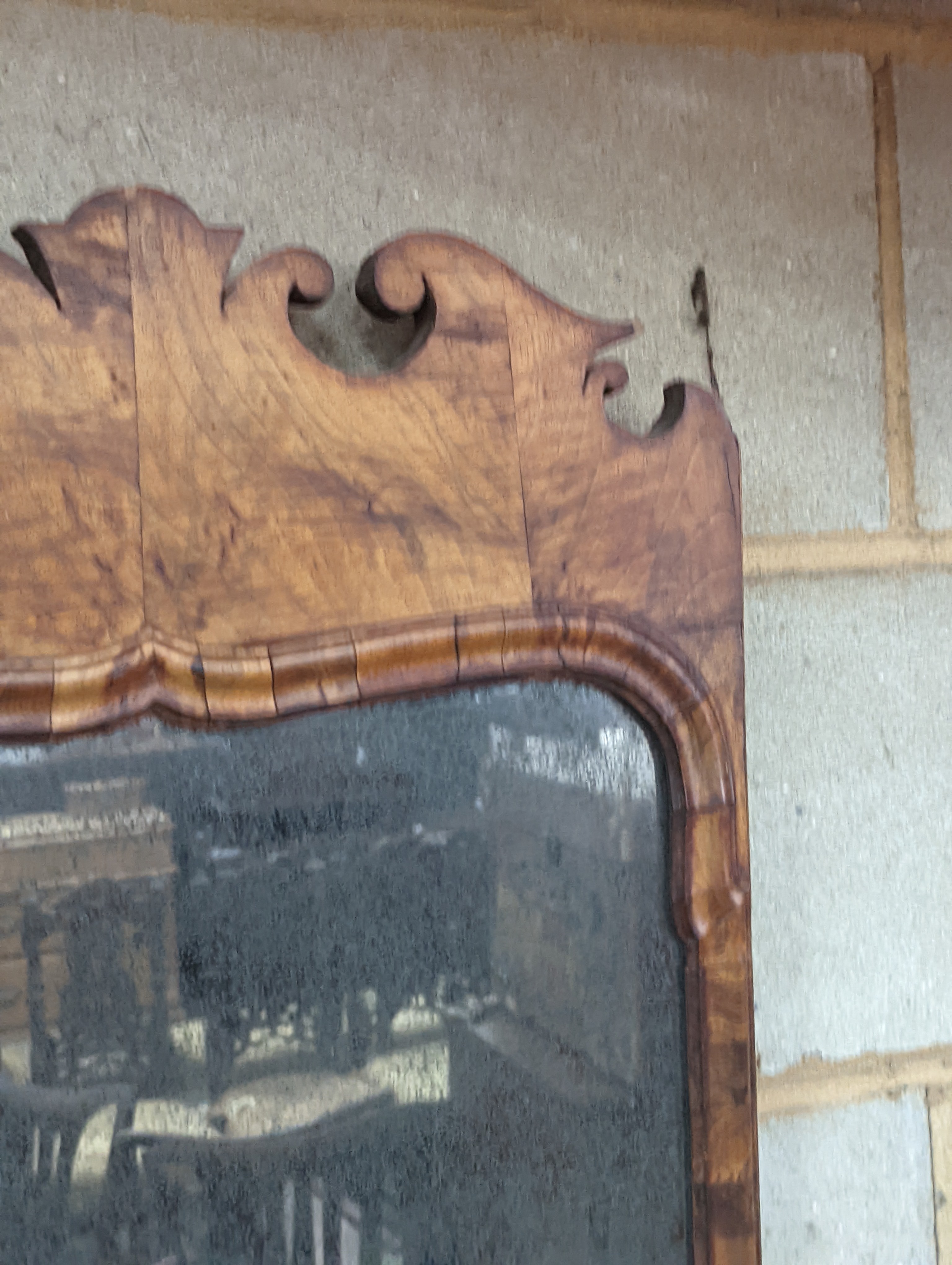 An 18th century walnut fret cut wall mirror, width 48cm, height 96cm